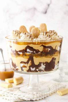 a dessert dish with chocolate and marshmallows in the center on a white table