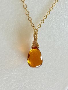 "Sunshine in a bauble! Breathtaking yellow Madeira citrine golden topaz briolette wire wrapped in 14k gold fill on a lovely 14k gold fill cable chain with spring ring clasp. The finest shade of citrine in a lush hydro quartz teardrop. Faceted gemstone measures 11 to 12mm. Available in 16\", 18\", and 20\" lengths. Stunning November birthstone!" Yellow Topaz Necklace, Golden Amber, Topaz Necklace, Amber Necklace, November Birthstone, Hippie Jewelry, Topaz Gemstone, Faceted Gemstones, Spring Rings