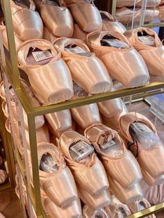 there are many pairs of ballet shoes on display