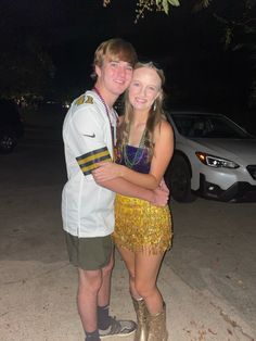 a young man and woman are posing for a photo