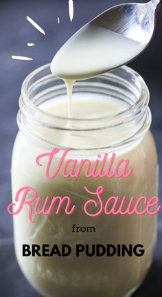 vanilla rum sauce from bread pudding in a glass jar with a spoon sticking out of it