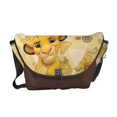 the lion king messenger bag is shown with an image of simba and nala on it