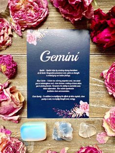 flowers and soaps on a wooden table with a sign that says genunii