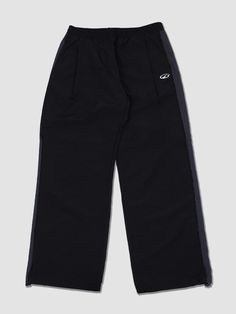 This is a comfortable and trendy pants that are made out of high quality nylon 100%  fabric. With design detail of wide silhouette, color blocked side panel, and minimal logo embroidery detail, it gives a trendy and modern look. - Deep tuck for wide silhouette- Adjsutable string on the hem- Elastic waistband with inner string Black Nylon Wide Leg Parachute Pants, Black Wide Leg Nylon Parachute Pants, Black Nylon Bottoms With Elastic Side Panels, Black Nylon Sporty Pants, Black Nylon Cargo Pants, Black Sporty Straight Parachute Pants, Black Functional Sweatpants With Elastic Side Panels, Black Nylon Sweatpants With Elastic Waistband, Black Nylon Pants With Elastic Side Panels