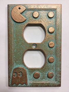 an old light switch plate with some holes in it