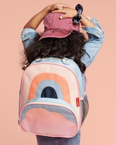 a girl with a back pack on her head