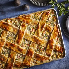 a pie sitting on top of a pan covered in cheese