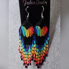 Rainbow Beaded Dangle Earrings Black Beaded Earrings With Ear Wire For Festival, Black Beaded Earrings For Festival, Black Beaded Drop Earrings For Festival, Black Beaded Dangling Earrings For Festival, Multicolor Beaded Earrings With Black Beads For Party, Black Beaded Dangle Earrings, Black Festival Chandelier Earrings With Dangling Beads, Black Chandelier Earrings With Colorful Beads As Gift, Black Chandelier Earrings With Colorful Beads For Gifts