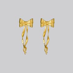 Make your heart flutter with our rendition of a pair of bow ribbon earrings. These earrings capture the luxury of style with the grace of a bow, a timelessly classic look with a modern twist. Also available in Silver. These earrings feature a base of sterling silver meticulously bonded with a generous layer of 24K gold (Gold Vermeil). Length: 41.5mm; Width: 15.3mm Designed in NYC Ribbon Earrings, Heart Flutter, Bow Ribbon, Earrings In Gold, The Grace, Gold Gold, Jewelry Care, Gold Vermeil, Classic Looks