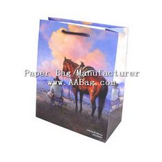 a paper bag with a horse painting on the front and side of it's handle