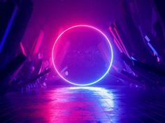 a circular object is shown in the middle of a room with neon lights on it