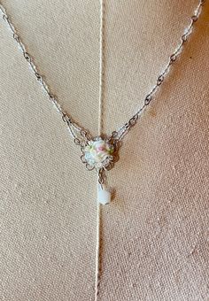 Colleen Toland Sweetheart Pink Rose Pendant Necklace. This is a beautiful necklace by Colleen Toland, featuring a pink rose pendant that is accented by small crystal beads and a crystal satin drop. The necklace has a wire-wrapped chain with rainbow crystal beads . The lobster claw clasp allows you to adjust the length of the necklace from 16 to 20 inches, and there is a metal tag with Colleen's name on it at the end of the chain. This is a lovely piece of jewelry that will make you feel like a s Wire Wrapped Chain, Metal Tag, Floral Jewelry, Metal Tags, Rose Pendant, Rainbow Crystal, Necklace Wedding, Wedding Bridesmaid, Vintage Bridal