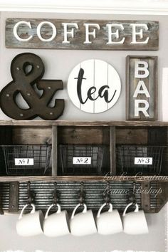 the coffee and tea bar is decorated with wood letters, baskets, and mugs