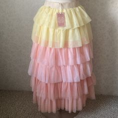 Yellow Pink Tiered Skirt Fitted Yellow Ruffled Skirt, Yellow Fitted Tiered Skirt, Fitted Yellow Tiered Skirt, Fitted Yellow Tiered Maxi Skirt, Yellow Flowy Ruffled Maxi Skirt, Flowy Yellow Ruffled Maxi Skirt, Yellow Tiered Ruffled Skirt, Yellow Ruffled Long Skirt, Yellow Ruffled Skirt For Spring