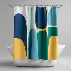 a shower curtain with an abstract design in blue, yellow and green on the outside