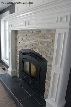 an empty living room with a fireplace in it