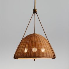 a light hanging from a ceiling fixture made out of wicker and metal wire with three lights on each side