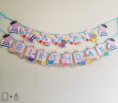 a happy 8th birthday banner with peppa pig and other characters hanging on a wall