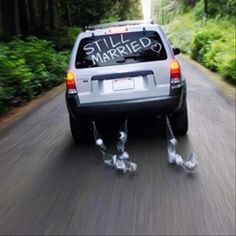 a car driving down the road with two legs attached to it's back end