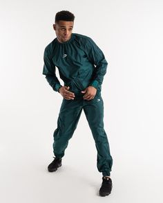 Man in a green sauna suit tracksuit with a white boxraw logo on the chest as well as adjustable wrist straps and made from polyester. Lifestyle Club, Sauna Suit, Training Clothes, Kangaroo Pouch, Injury Prevention, Range Of Motion, Navy And Green, Black Friday Sale, Body Goals