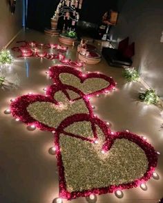 the floor is decorated with flowers and lights for valentine's day celebrations, as well as heart - shaped candles