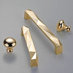 an assortment of gold knobs and handles