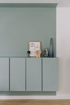 a painting on top of a cabinet in a room