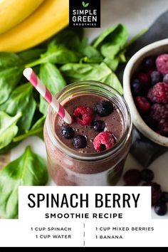 spinach berry smoothie recipe in a mason jar next to fresh berries and bananas