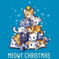 a group of cats sitting on top of each other in front of a christmas tree