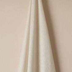 a white towel hanging on the wall