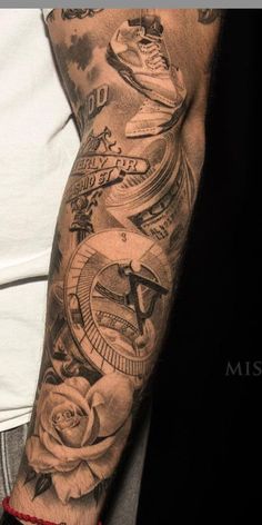 a man with a tattoo on his arm has a clock and roses around him,