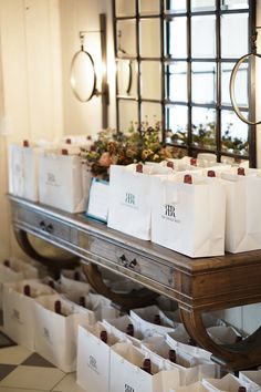 many bags are lined up on a table