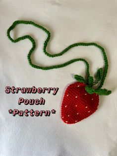 a crocheted strawberry is attached to a white t - shirt that says, strawberry pouch pattern