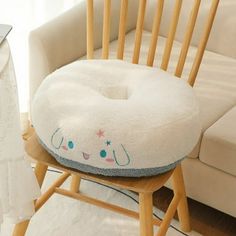 a chair with a pillow on top of it