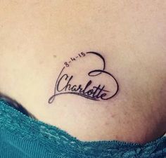 a woman's stomach with the word charlotte written in cursive writing on it