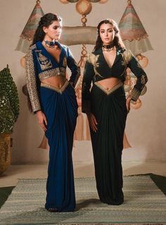 Introducing the paan petha set, a fusion outfit that blends traditional artistry with contemporary style. This captivating ensemble features a crop jacket, richly embroidered with zardozi, dabka, and moti work, reflecting the opulence of indian craftsmanship. The jacket is adorned with enchanting motifs like the son chidiya and berry bel, symbolizing grace and natural beauty, making this piece truly one-of-a-kind.The ensemble is completed with a draped skirt, designed with a flattering v-cut wai Luxury Dabka Choli In Traditional Drape, Luxury Sharara With Zari Weaving In Traditional Drape, Luxury Brocade Sharara With Zari Weaving, Luxury Skirt Set With Zari Work In Traditional Drape, Luxury Blouse Piece With Zari Weaving In Traditional Drape, Luxury Georgette Skirt Set For Reception, Luxury Skirt Set With Zari Work For Reception, Luxury Designer Wear Crop Top For Festive Season, Luxury Traditional Wear With Cutdana For Festivals