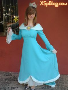 a woman dressed in a princess costume posing for the camera