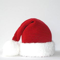 a red and white crocheted santa hat