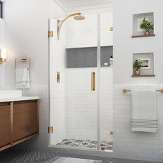 a bathroom with a shower, sink and mirror