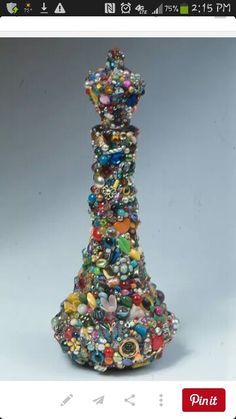 a tall tower made out of beads and other items