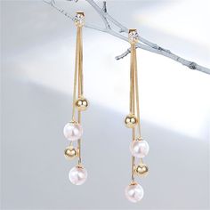 Bring a little bling to any ensemble with these shimmering drop earrings encrusted with cubic zirconia and dangling with pearl beads 0.67" W x 4.06" L 18k gold-plated copper / pearl / cubic zirconia New Year Jewelry, Flowers Heart, Pearl Bow, Copper Pearl, Beach Birthday, Beaded Tassel Earrings, Tassel Drop Earrings, Knot Earrings, Mom Daughter