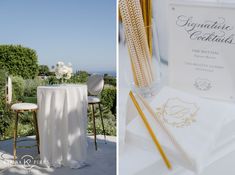 the table is set up for an elegant wedding reception with gold and white decor, along with a sign that says signature cocktails