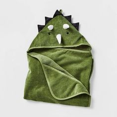 a green towel with an animal face on it