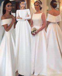 three women in white dresses standing next to each other