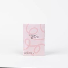 a pink packet with the words sweet grace on it sitting in front of a white background