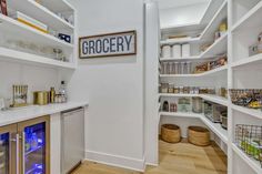 the pantry is stocked with many items and has plenty of space to put food in