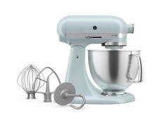 an image of a blue kitchen mixer set up on a white background with attachments