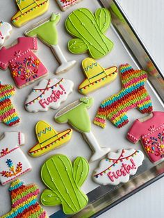 some decorated cookies are sitting on a tray