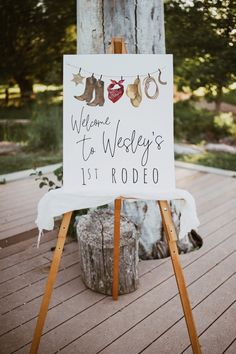 a welcome sign is displayed on an easel