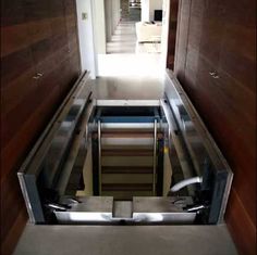 an escalator is shown with metal railings and drawers on the bottom floor